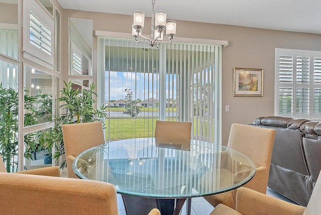 dining room with a notable chandelier and a wealth of natural light