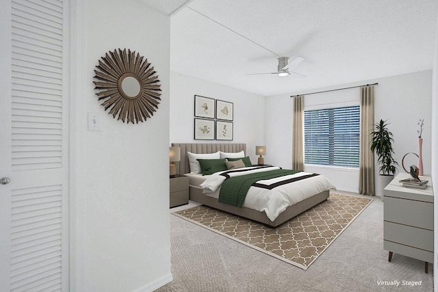 bedroom with ceiling fan and carpet