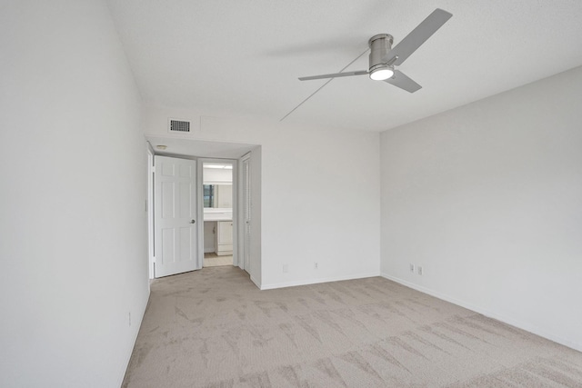 unfurnished bedroom featuring carpet floors, a ceiling fan, and baseboards