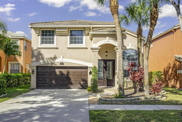 mediterranean / spanish-style house featuring a garage