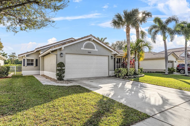 single story home featuring a garage and a front yard