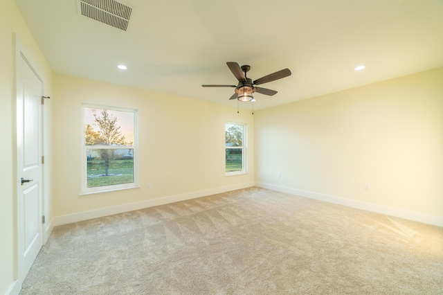 carpeted empty room with ceiling fan