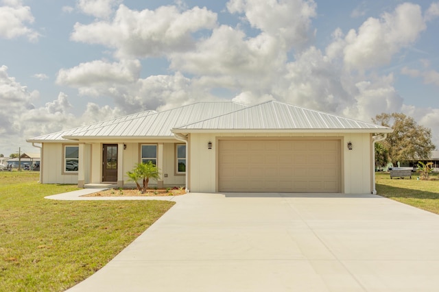 view of front facade with a garage and a front lawn