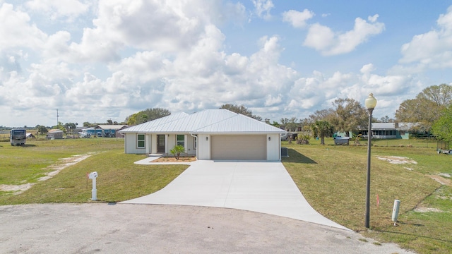 ranch-style home with a garage and a front yard