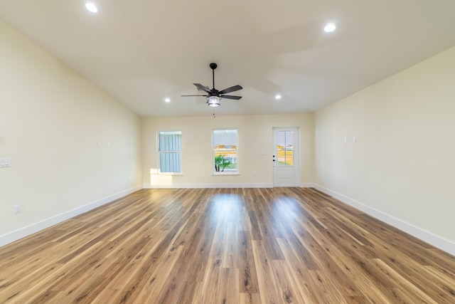 unfurnished living room featuring ceiling fan and light wood-type flooring