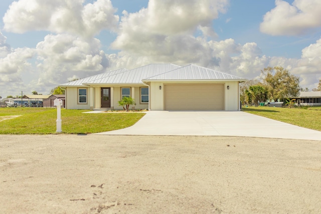 ranch-style house with a garage and a front yard