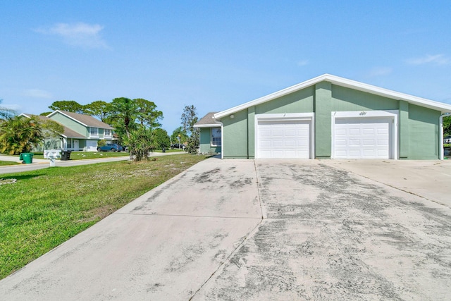 garage featuring a lawn