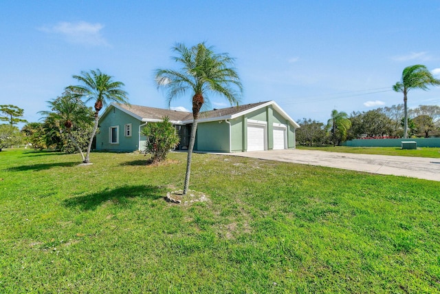 ranch-style home with a front lawn and a garage