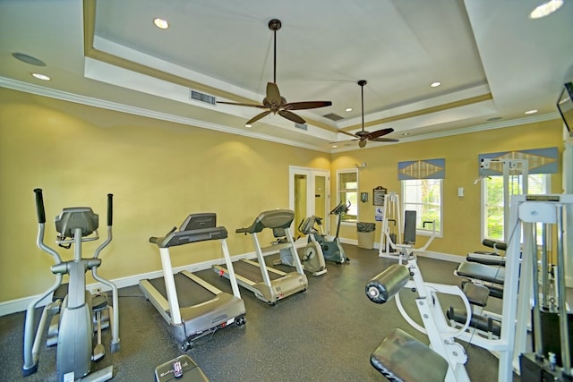 exercise room with baseboards, visible vents, a raised ceiling, crown molding, and recessed lighting