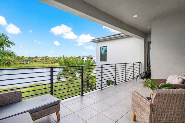 balcony featuring a water view