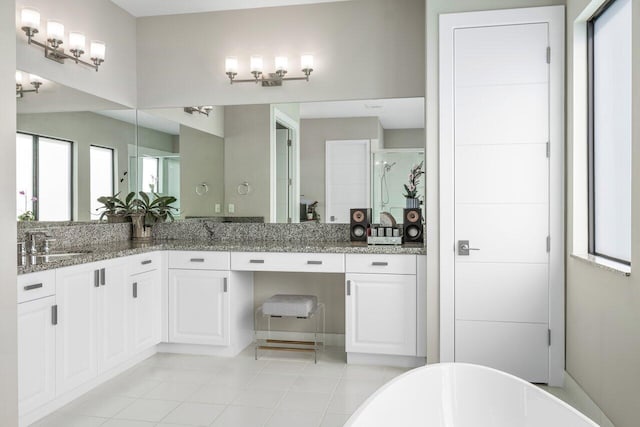 bathroom featuring vanity, tile patterned floors, and separate shower and tub