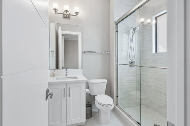 bathroom featuring vanity, an enclosed shower, tile patterned floors, and toilet