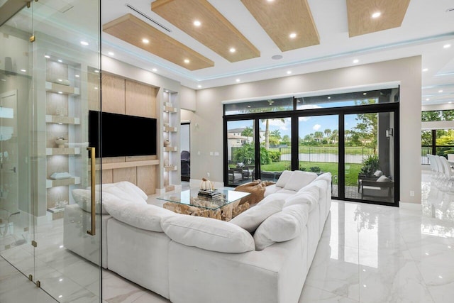 living room featuring a towering ceiling and french doors