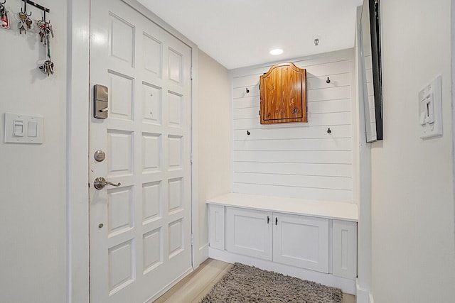 mudroom with light hardwood / wood-style floors