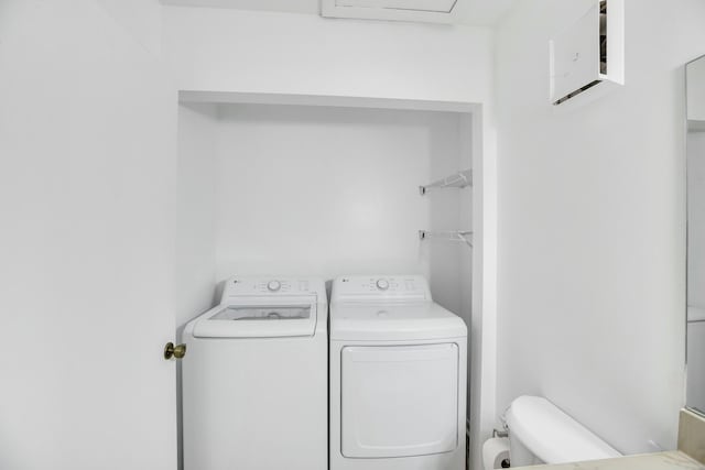 laundry room featuring washing machine and clothes dryer