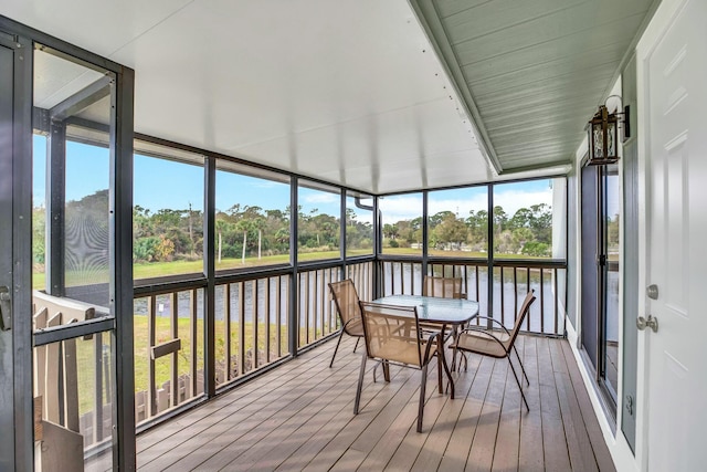 sunroom with a water view