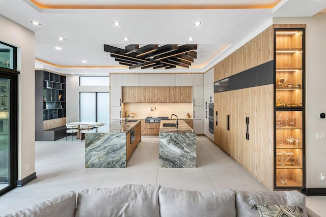 living room with light tile patterned flooring and sink