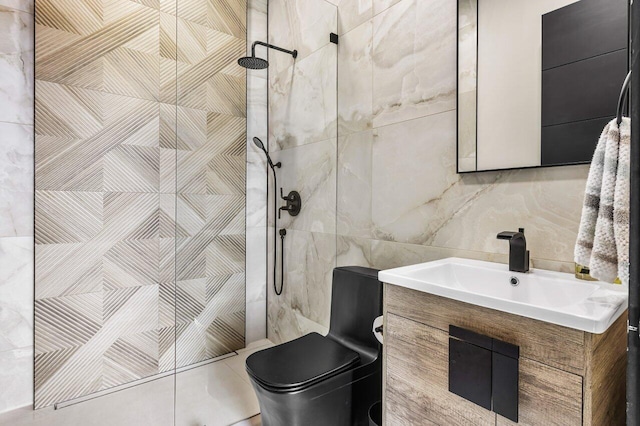 bathroom featuring vanity, tiled shower, tile walls, and toilet