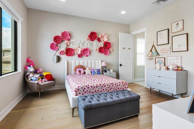 bedroom with light hardwood / wood-style flooring