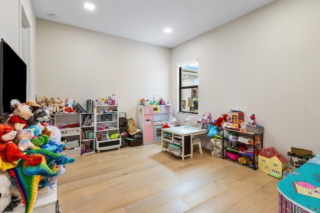 recreation room featuring hardwood / wood-style flooring