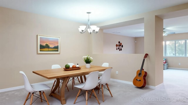 6906 NW Kowal Ct, Port Saint Lucie, FL 34986 - dining room featuring a chandelier, light carpet, and baseboards