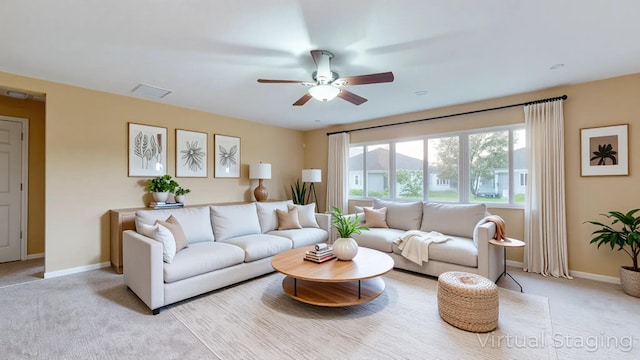 6906 NW Kowal Ct, Port Saint Lucie, FL 34986 - living room featuring ceiling fan, light carpet, and baseboards
