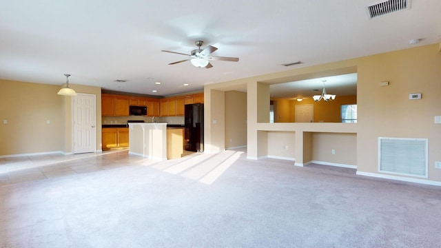 6906 NW Kowal Ct, Port Saint Lucie, FL 34986 - unfurnished living room featuring a chandelier, baseboards, light carpet, and a ceiling fan