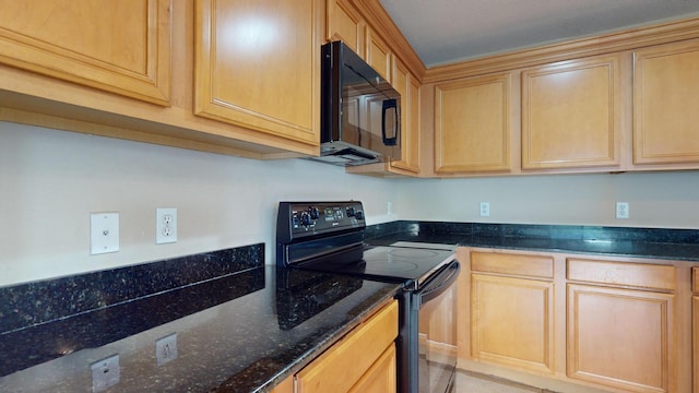 kitchen with light brown cabinetry, dark stone counters, and black appliances