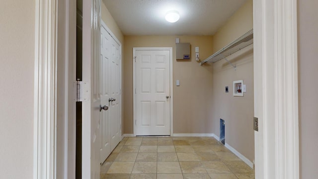 clothes washing area featuring baseboards, laundry area, washer hookup, and hookup for an electric dryer