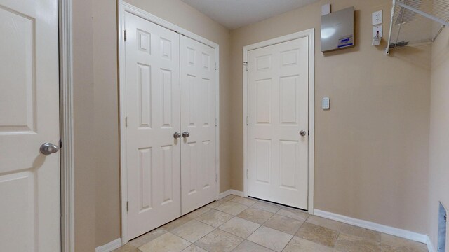 laundry room with washer hookup, hookup for a gas dryer, hookup for an electric dryer, and light tile patterned flooring