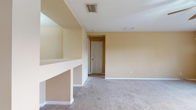 6906 NW Kowal Ct, Port Saint Lucie, FL 34986 - spare room featuring ceiling fan, light colored carpet, and baseboards