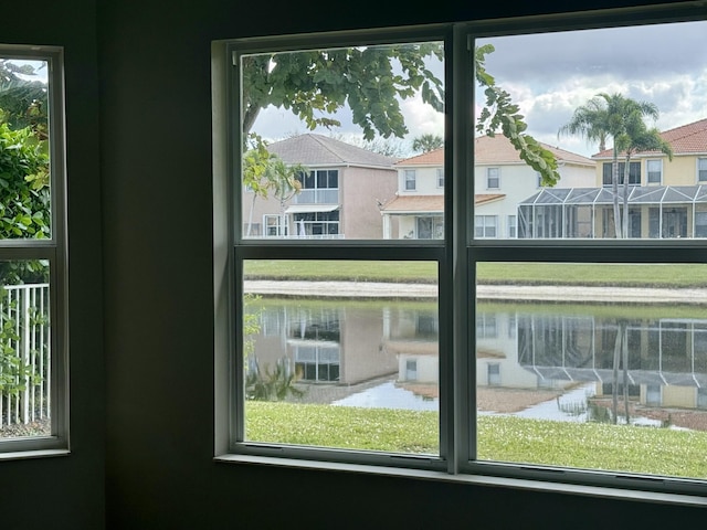 doorway to outside with a water view