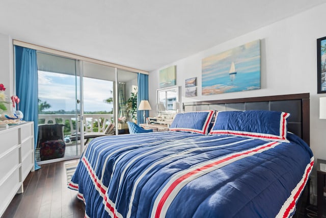 bedroom with floor to ceiling windows, dark hardwood / wood-style flooring, and access to exterior