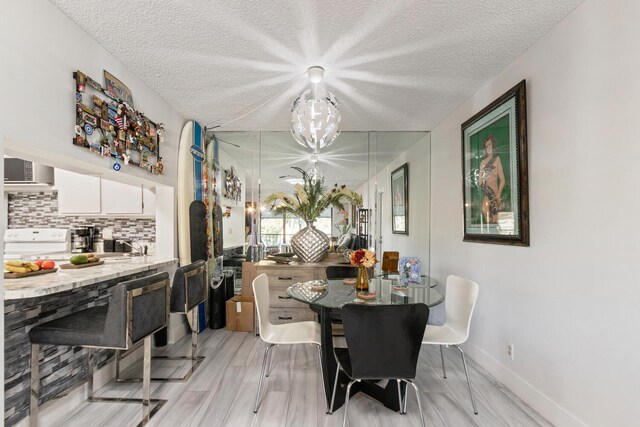 dining area with a textured ceiling