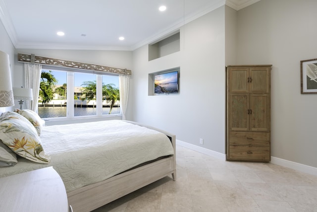 bedroom with high vaulted ceiling, ornamental molding, and a water view