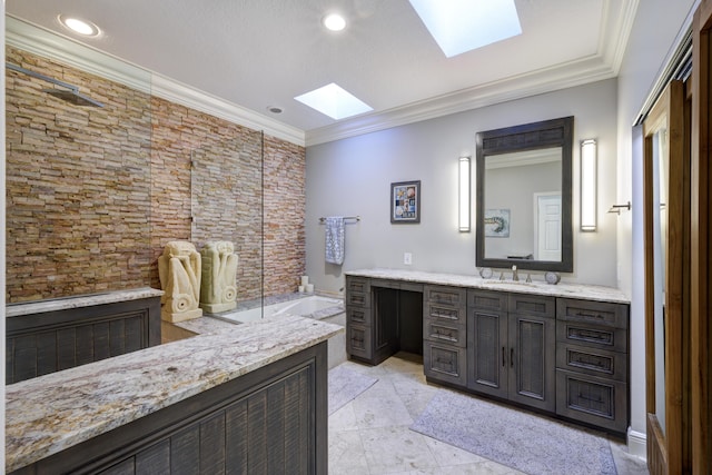 bathroom featuring vanity, a tub to relax in, crown molding, and a skylight