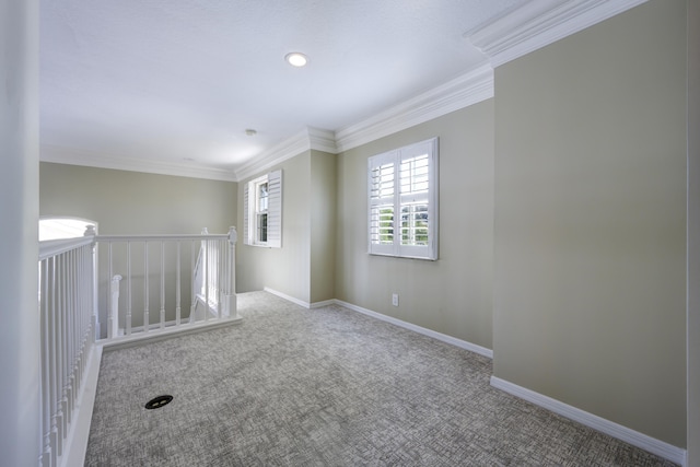 carpeted empty room with crown molding