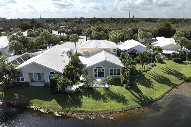 birds eye view of property featuring a water view