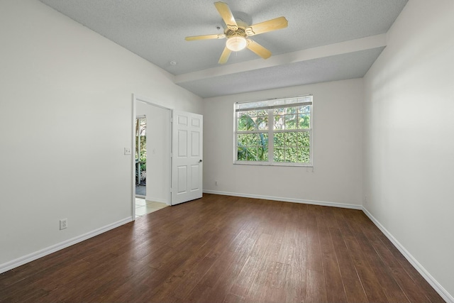 unfurnished room featuring ceiling fan, a textured ceiling, and dark hardwood / wood-style flooring