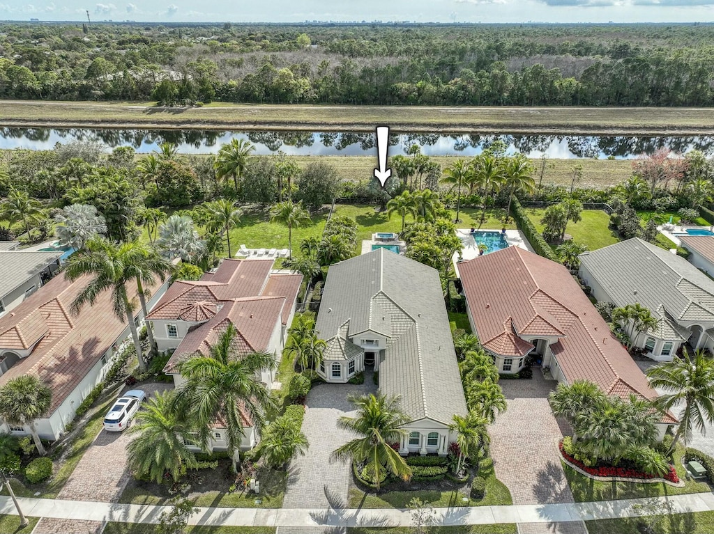 birds eye view of property featuring a water view