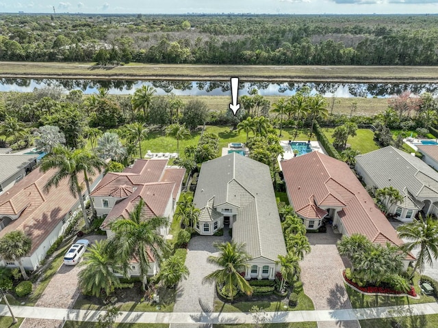 birds eye view of property featuring a water view