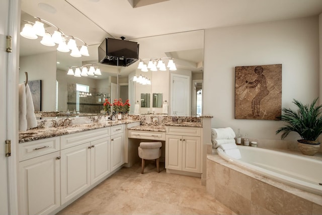 bathroom featuring vanity and shower with separate bathtub