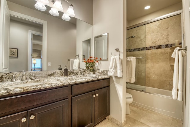 full bathroom with shower / bath combination with glass door, tile patterned flooring, vanity, toilet, and an inviting chandelier