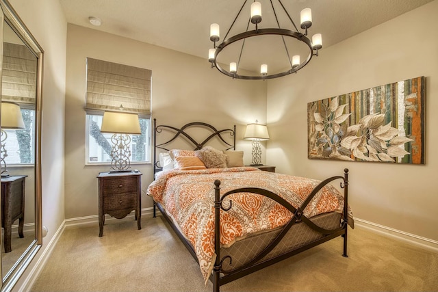 carpeted bedroom with a notable chandelier