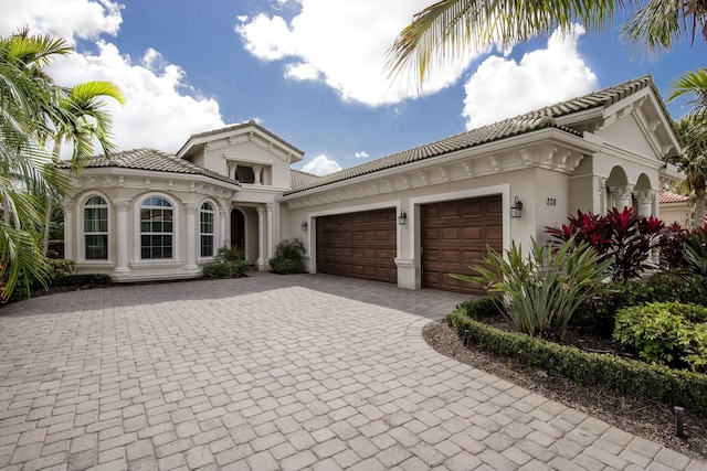 mediterranean / spanish-style house featuring a garage