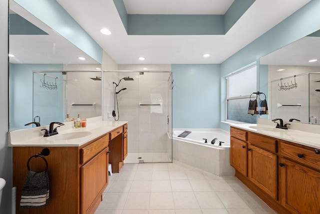 bathroom with vanity, tile patterned flooring, and shower with separate bathtub