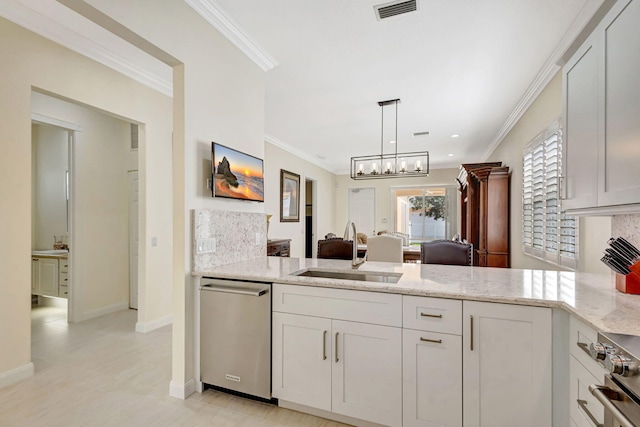 kitchen featuring white cabinets, appliances with stainless steel finishes, visible vents, ornamental molding, and a sink