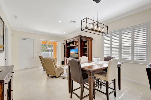 dining space with baseboards, crown molding, visible vents, and recessed lighting