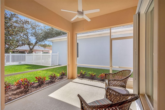 sunroom with a ceiling fan