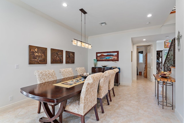 dining area featuring ornamental molding